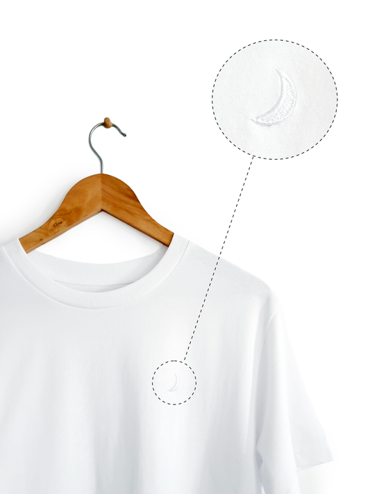 Ethical and sustainable, white organic cotton tee / t shirt with embroidered crescent moon for yoga, gym, or lounge.