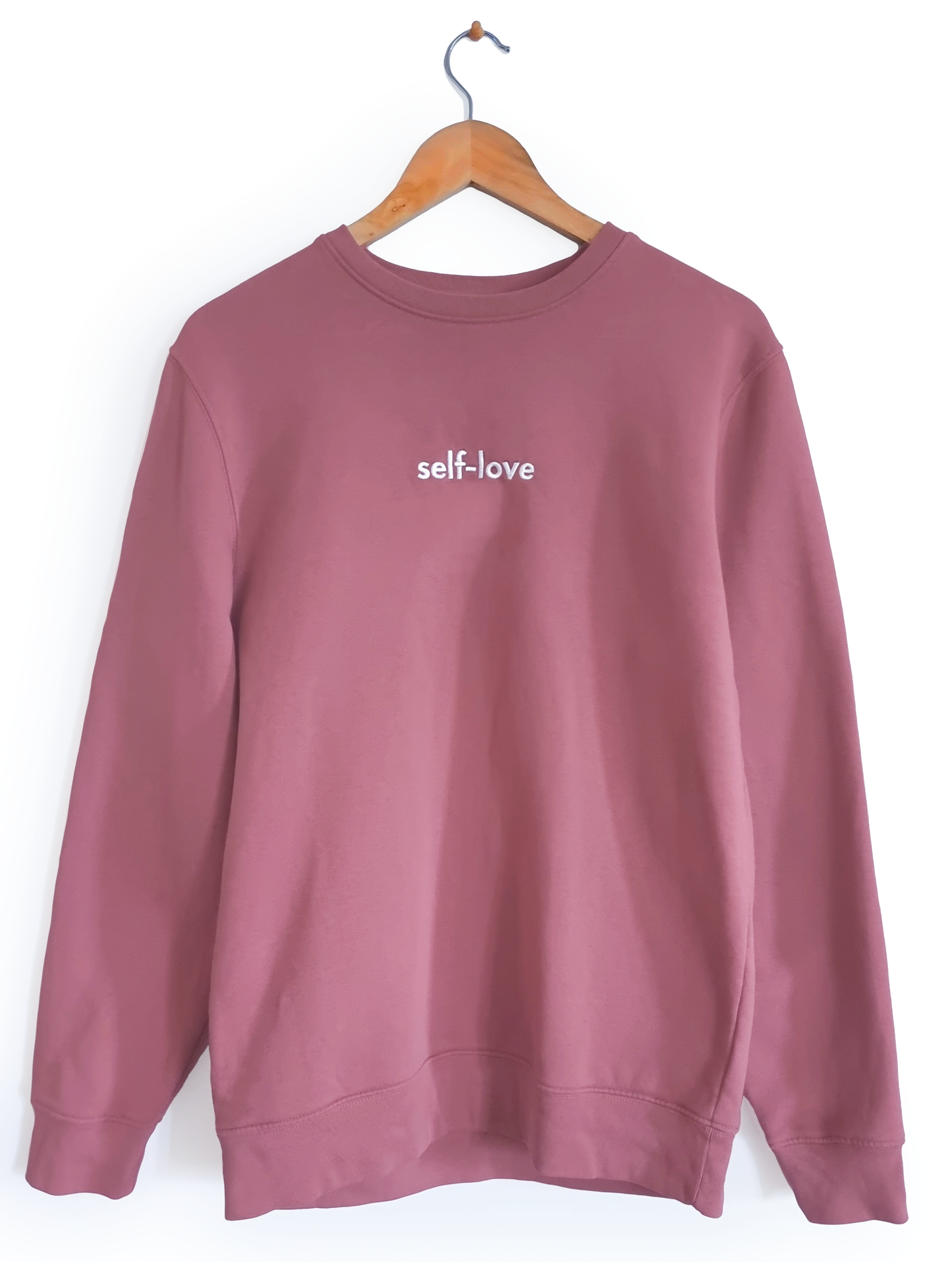 Ethical and sustainable, organic and recycled sweatshirt / sweater in mauve / pink / purple with embroidered self-love design for yoga, gym, or lounge wear.