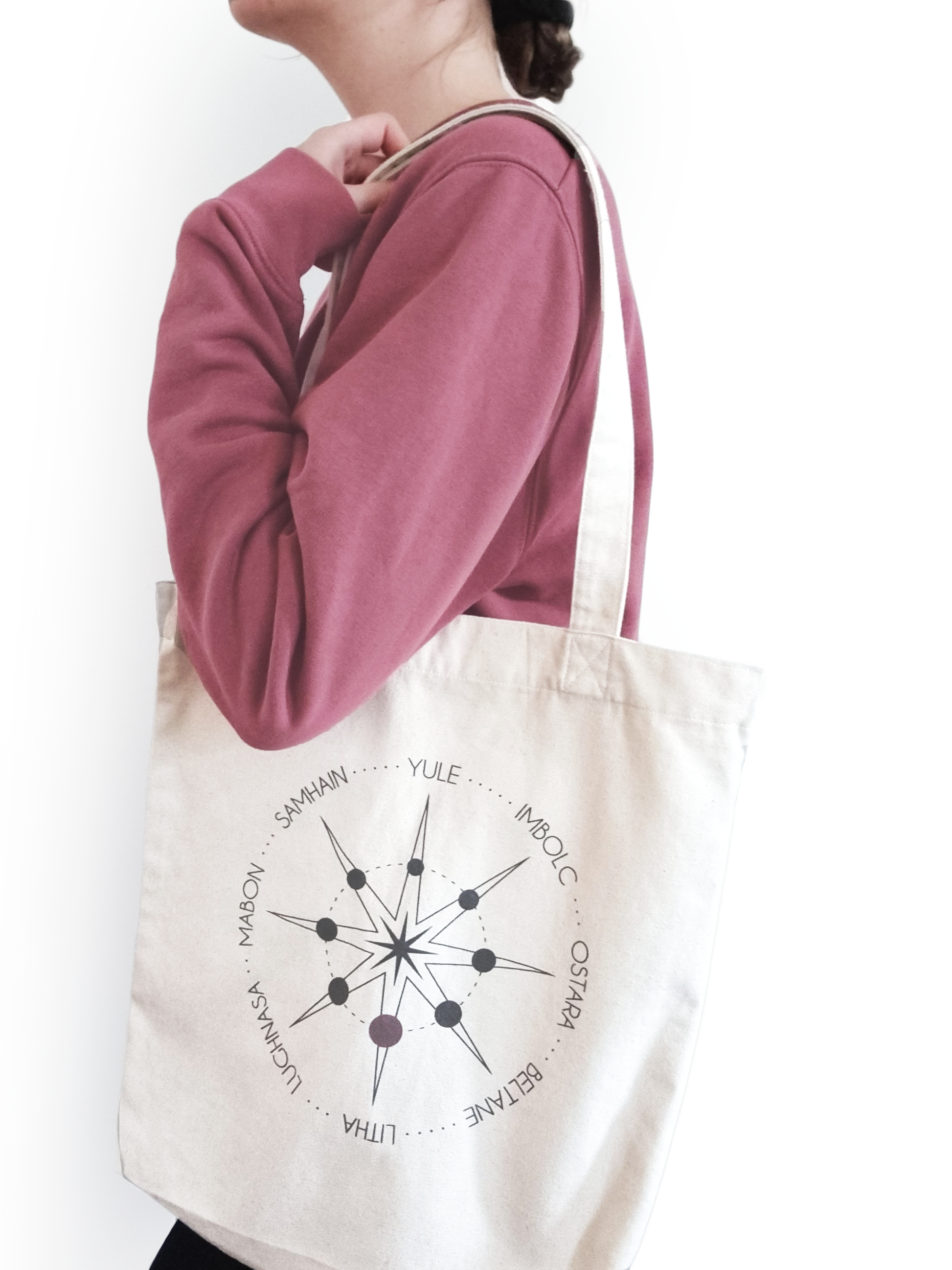 Ethical and sustainable, natural raw, organic and recycled tote bag / shopping bag / shopper with a printed witchy / pagan / wiccan / spiritual wheel of the year design for yoga, gym, or lounge wear.